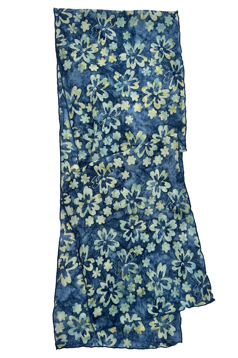 A lightweight blue scarf with a watercolor-style floral print in light blue, green, and yellow, shown flat.