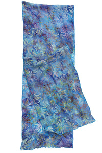 A lightweight sheer scarf with a blue, purple, and teal floral batik print, shown flat.