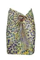 Batik printed mini sarong wrapped as a skirt with a coconut buckle to tye it