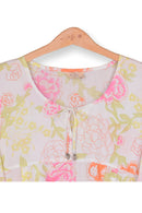Floral-patterned garment on a wooden hanger with a white background