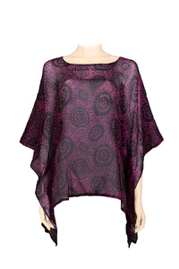 Purple patterned poncho on a mannequin against a white background