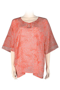 crocodots patterned blouse printed batik in orange and white colors