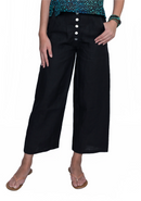 Person wearing black wide-leg pants with a buttoned front on a white background