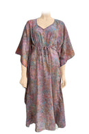A kaftan-style maxi dress with a V-neck and drawstring waist,  The dress features an abstract, painterly pattern in muted shades of pink, purple, blue, and green.