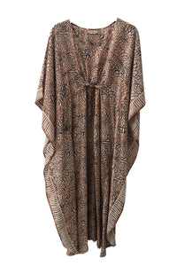 Long kaftan hundred percent silk printed batik by hand - broken flower design - earthy tones - with self fabric inner belt pulled to show the folds