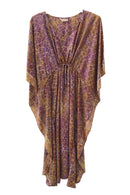 Long kaftan hundred percent silk printed batik by hand - flower design - purple & orange tones - with self fabric inner belt pulled to show the folds